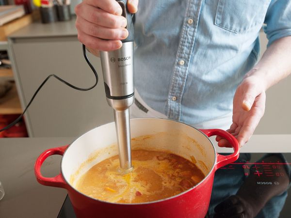 blending soup with a hand blender