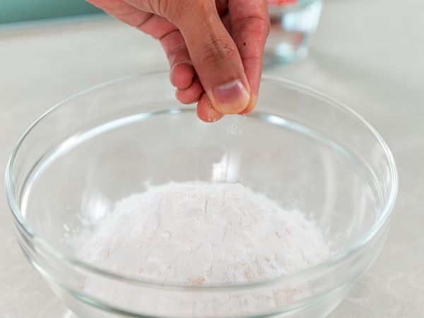 1. In a mixing bowl, add quinoa flour, tapioca flour, salt and mix with a whisk. While whisking, add water, and continue until the batter is well combined.