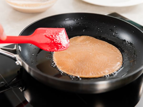 2. In a medium-heated non-stick pan, spread 1 tablespoon of cooking oil evenly. With a ladle, add a portion of batter to form your desired size of the “pizza” base. Adjust the heat of your hob to the point before the pan smokes for the “pizza” base to set and browned lightly. Cook for about 2 minutes on each side, and set aside. They can also be used as gluten-free wraps.