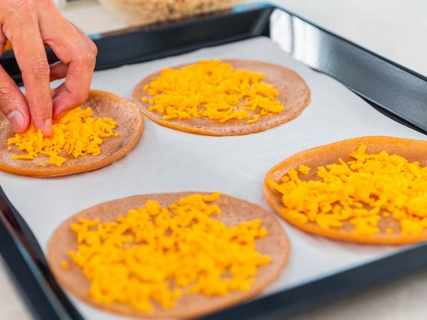 5. Preheat your Oven with Grill Mode at Level 2. Line baking tray with baking paper and place “pizza” base on tray. Spread vegan cheese generously over “pizza” base. Distribute cooked toppings evenly. Sprinkle remaining cheese and top it off with fresh Thai basil leaves.