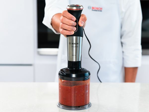Blend canned tomatoes into paste using your Hand Blender.