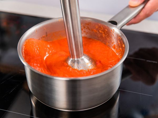 Using your Hand Blender, blend the mixture while simmering