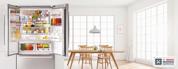 Open fridge doors showing inside contents in white spacious room