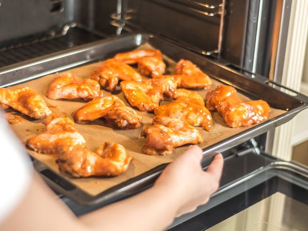 Moving pan of wings into Bosch oven