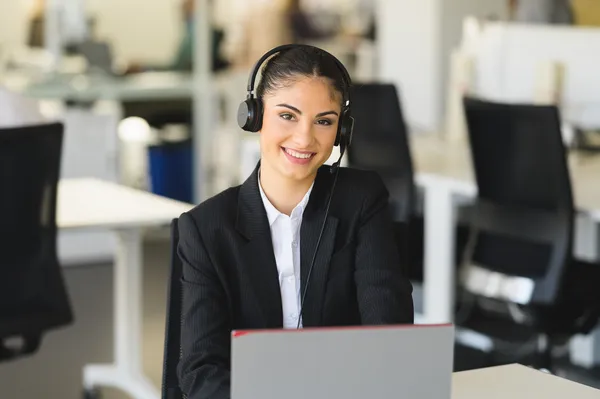 Customer support representative with laptop