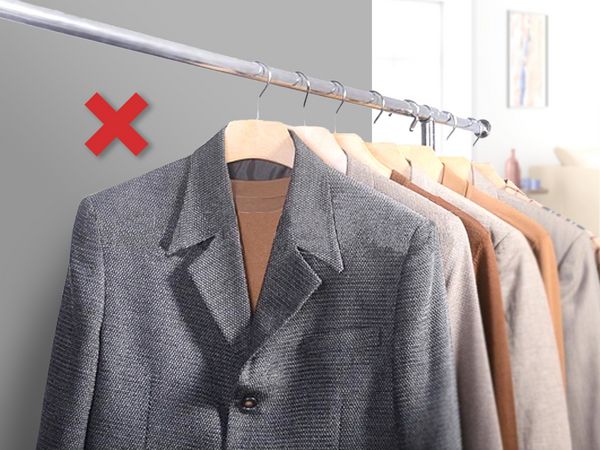 An image of coats and jackets with a cross sign.