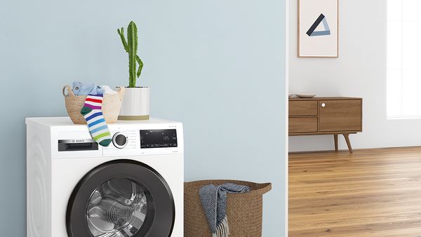 Timer on top a Bosch washer set to time a 45-minute quick wash programme.