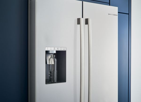Bosch refrigerator filling a free standing bottle with water