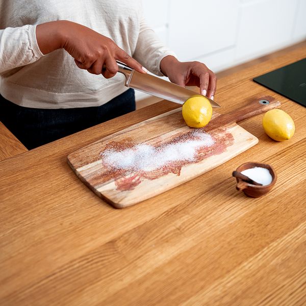 Cutting lemon on a cutting board