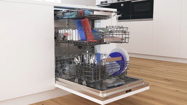 An open dishwasher full of dishes.