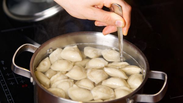 Boiling dumplings in a pan of hot water