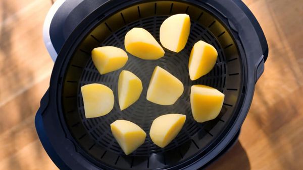 Top view of a cookit in which potatoes are steamed.
