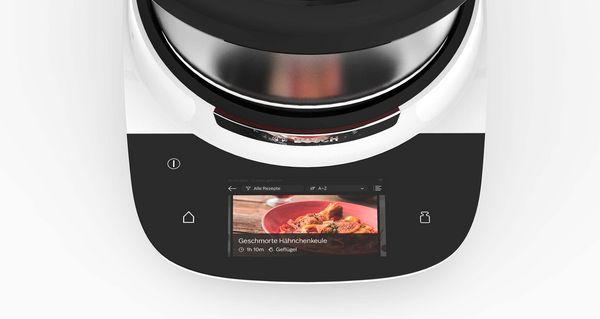Cookit next to a smartphone with the home connect app open. 