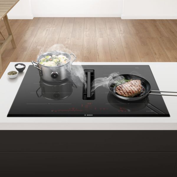Cooktop with integrated ventilation module.