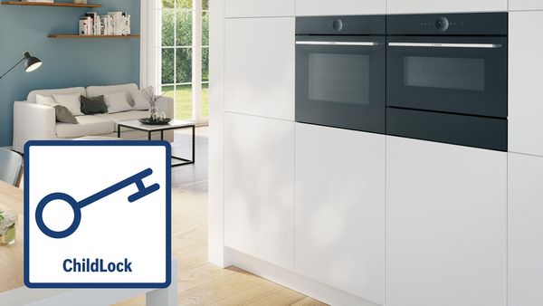 An image of a bright and modern kitchen with built-in ovens. On the image is a child-lock icon displaying a lock.