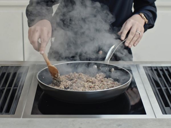 Close up of Chef Clare Smyth cooking at home with the Vario 400 series appliances 
