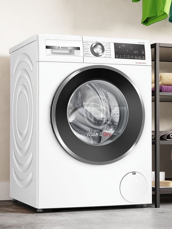 A washing machine and dryer next to each other in a modern bathroom.