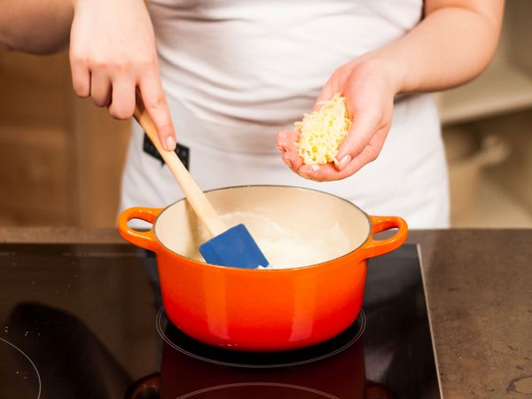 Adding cheese to the pan