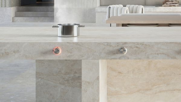 Kitchen island with an active control knob on the fascia