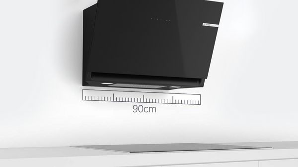An inclined cooker hood with a ruler superimposed below it showing 90cm.