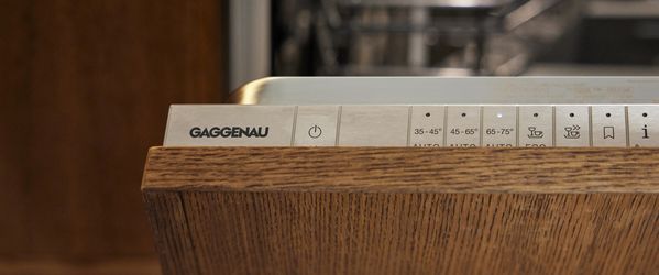 Close-up of the Gaggenau 400 dishwasher control panel with matching kitchen fascia