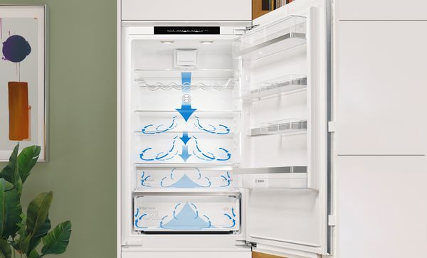 Frigorífico combi integrado XXL abierto y vacío. Las flechas azules indican el flujo de aire en el refrigerador.