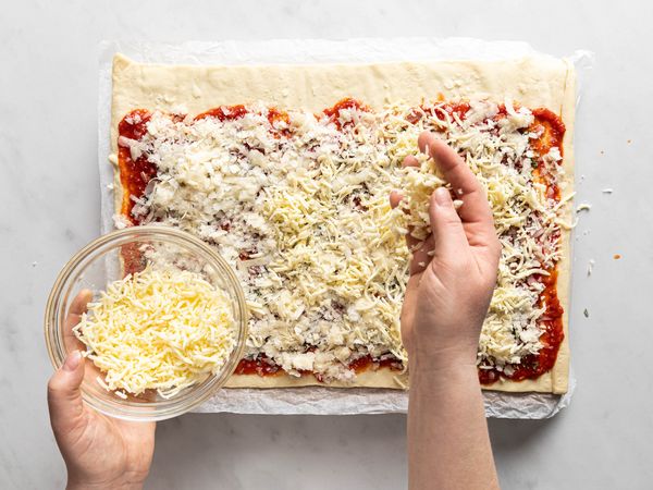 Adding cheese to the dough