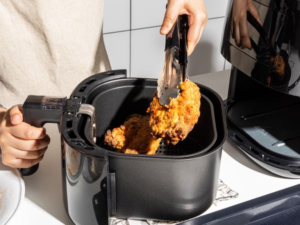 Taking chicken out of the air fryer