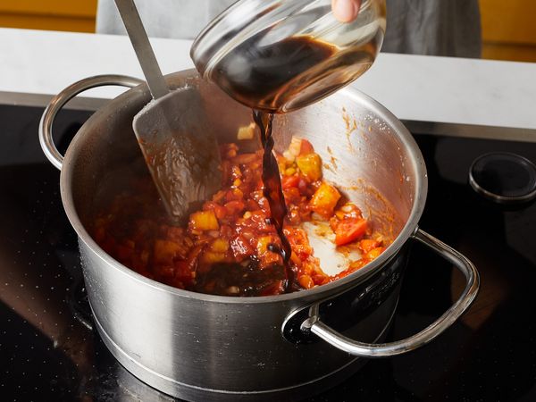 Adding sauce into a mixed pan