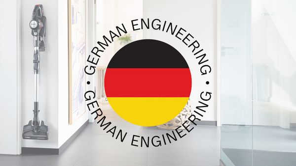 A teaser saying "German engineering" is superimposed on a shot of an entrance area where a stick vacuum is mounted.