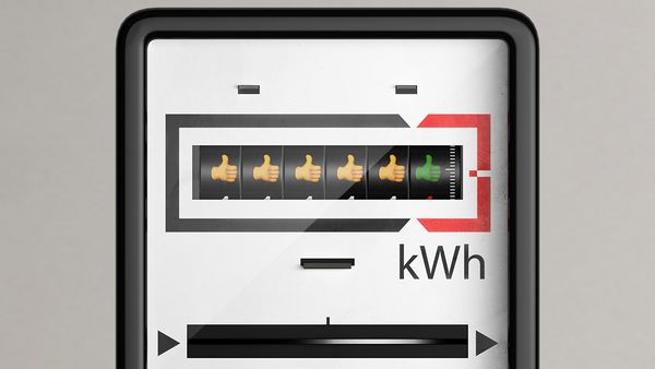 Un contador de electricidad con emojis de pulgares hacia arriba para indicar una buena eficiencia energética.