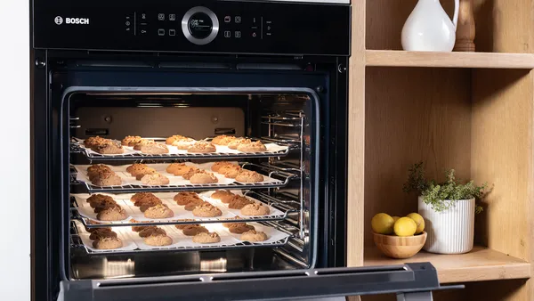 Close up of a Bosch oven with delicious cookies inside.