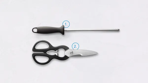 A sharpening steel and a pair of kitchen scissors numbered 1 and 2.