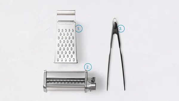 A box grater, pasta maker and pair of tongs numbered 1 to 3.