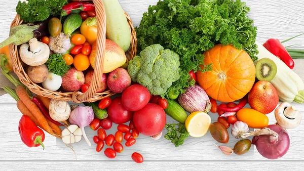 Fresh ingredients are spread across a wooden underground.