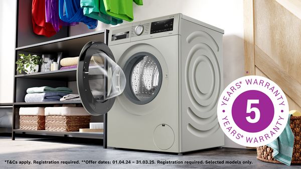Washing machine with door open with 5 year warranty logo and details