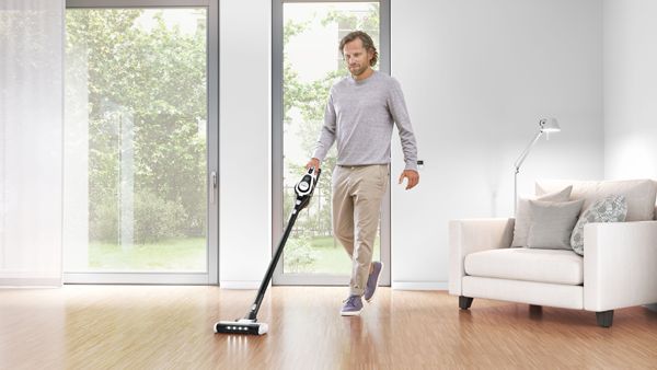 Person using cordless vacuum