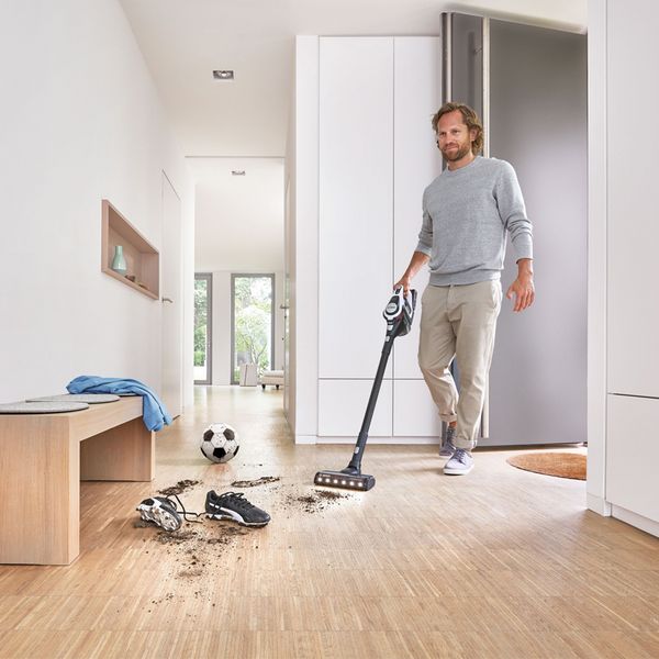 Person using an Unlimited vacuum on hardfloor