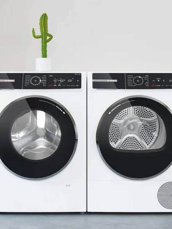  a washing machine and tumble dryer next to each other