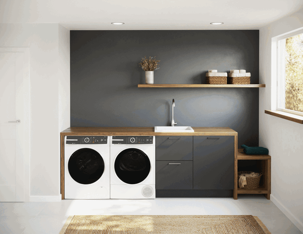 Bosch washer and dryer stacked with washer door open