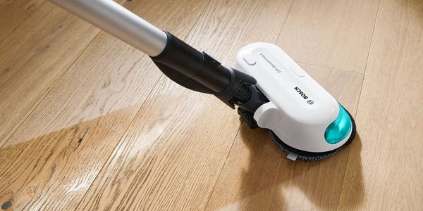 An Aqua7 vacuum cleaner on a vinyl floor