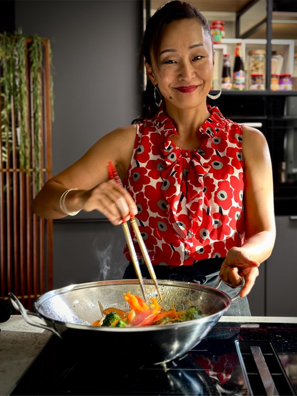 Sachie using the Vented Cooktop whist cooking stirfry