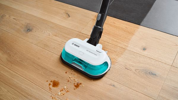 Person cleaning hardfloor mess using Unlimited 7 Aqua