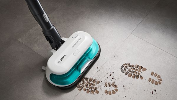 A vacuum cleaner with footprints on the floor