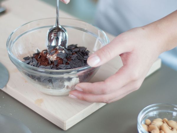 Mixing chocolate shavings into bowl