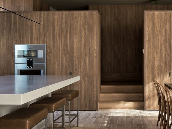 Casa Piva’s kitchen uses Gaggenau appliances and warm Antique Oak panelling throughout