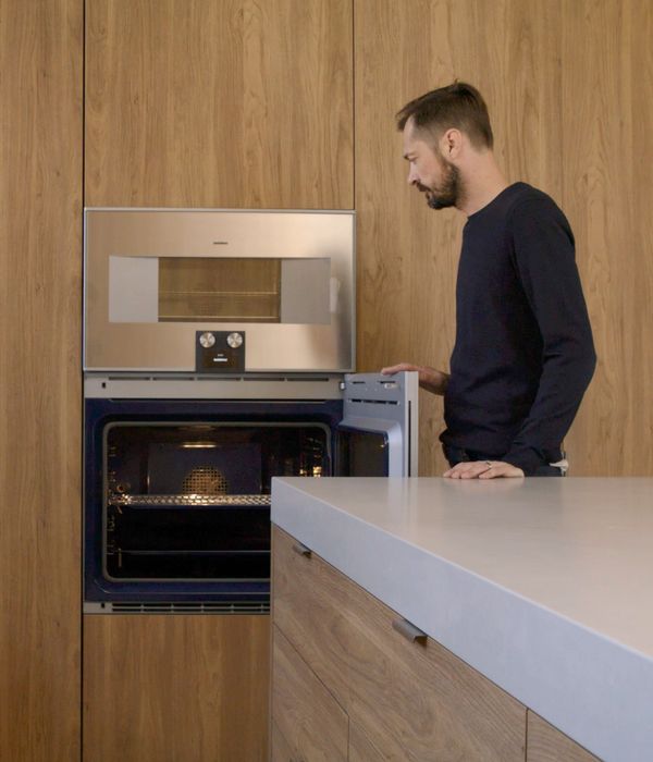 Architect Andrew Piva opens his Gaggenau 400 series convection oven in his family home.