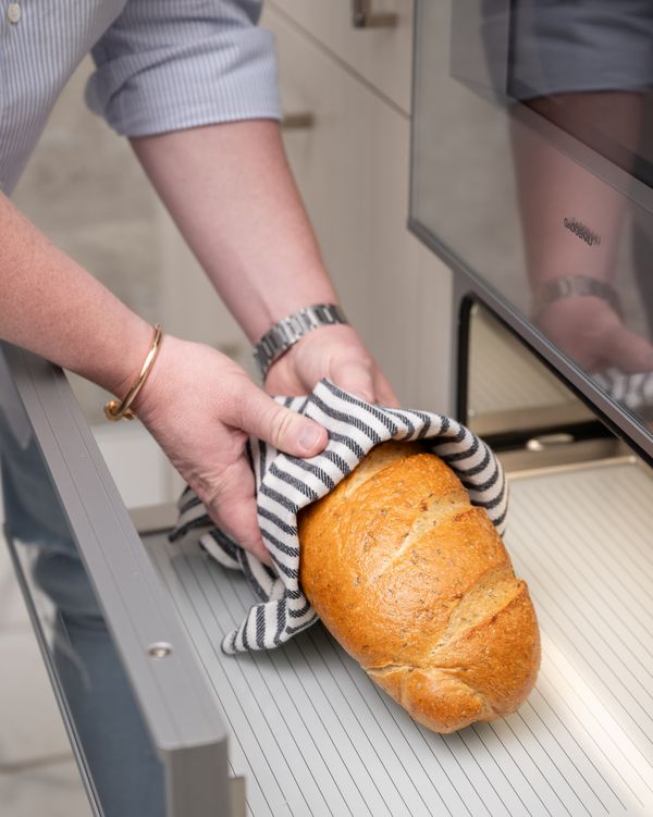 Jonathan Savage using his Gaggenau warming drawer to heat bread