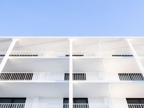 The view looking up of Savage’s Ibis Isle condominium with clear blue skies