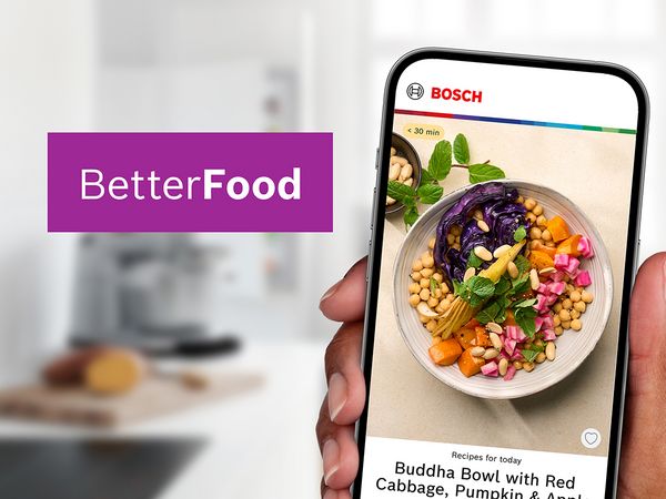 Uno smartphone visualizza una ricetta colorata della Buddha bowl intitolata "Better Food" di Bosch, con verdure vivaci e guarnizioni.